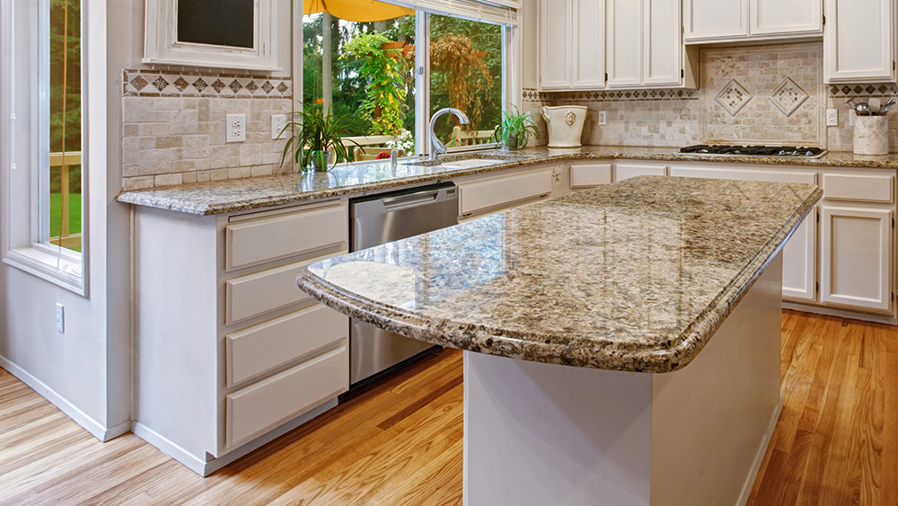 Luxury kitchen with an island supported by Federal Brace's Anthem Corner Support Bracket.